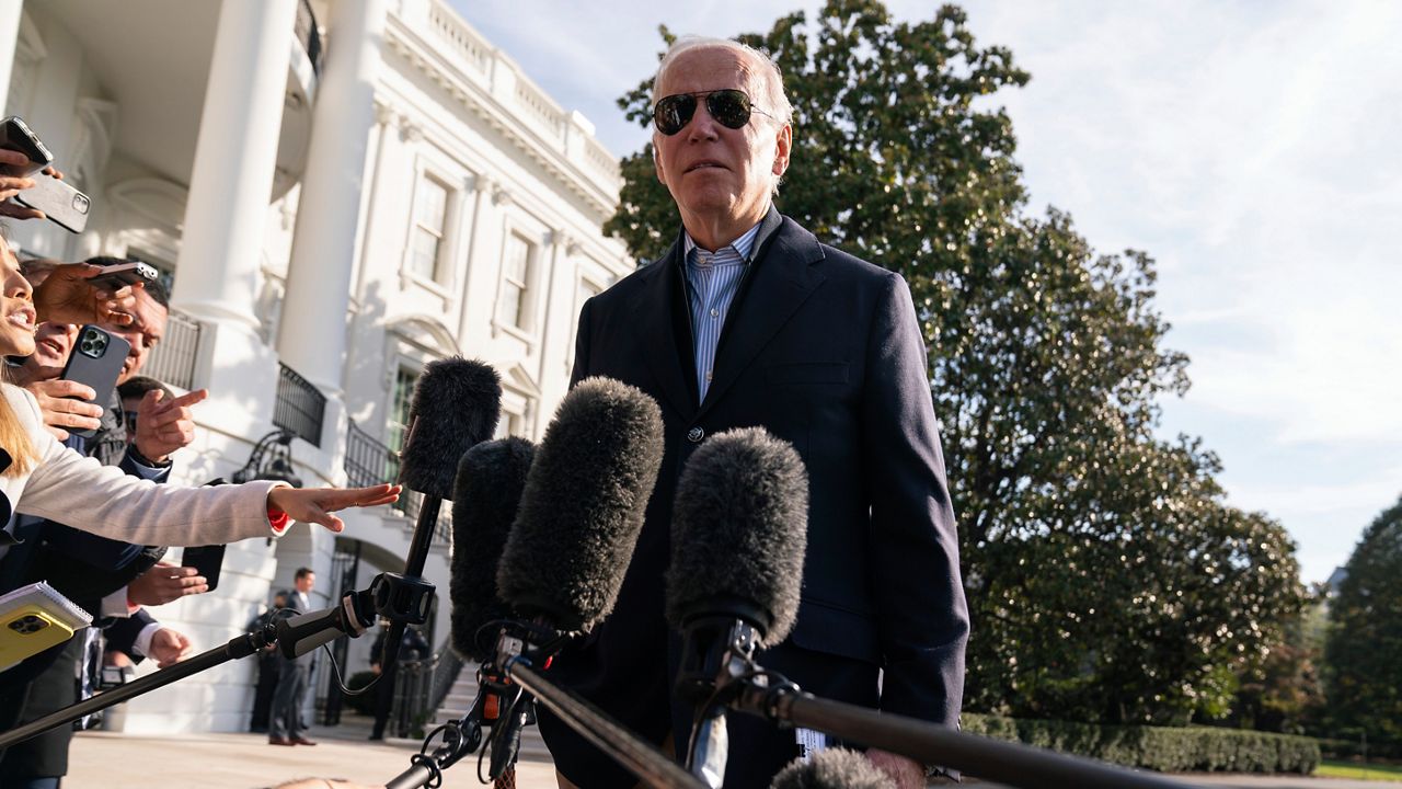 President Joe Biden talks to reporters before boarding Marine One on the South Lawn of the White House, Wednesday, Oct. 12, 2022, in Washington. (AP Photo/Evan Vucci)