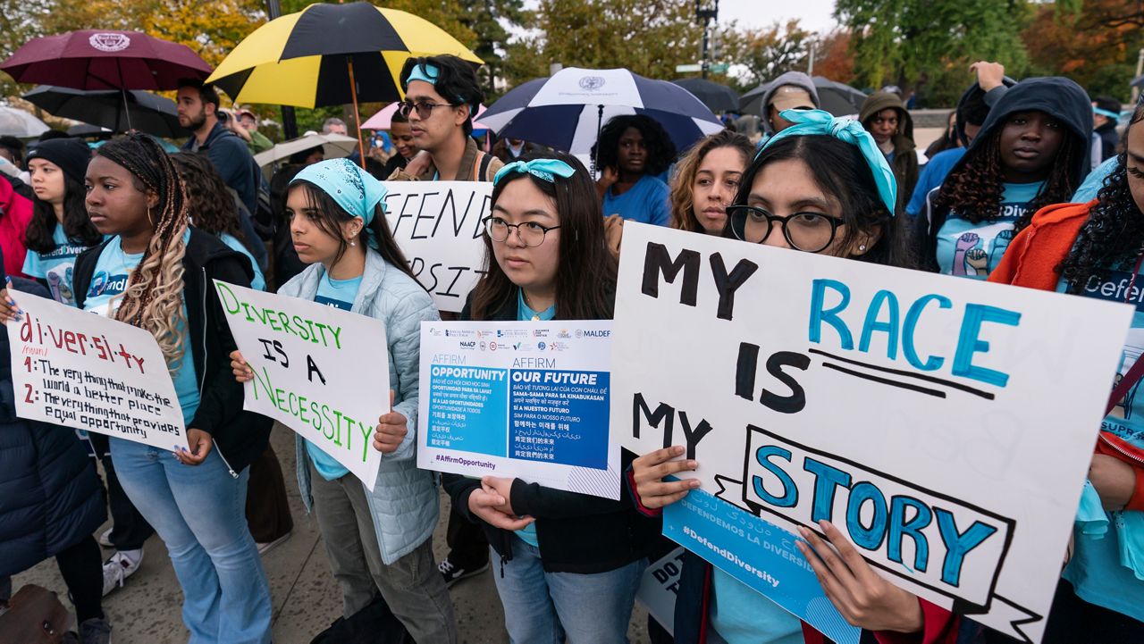 Harvard student, Samaga Pokharel, right, and other activists rally as the Supreme Court hears oral arguments on a pair of cases that could decide the future of affirmative action in college admissions, in Washington, Monday, Oct. 31, 2022. (AP Photo/J. Scott Applewhite)