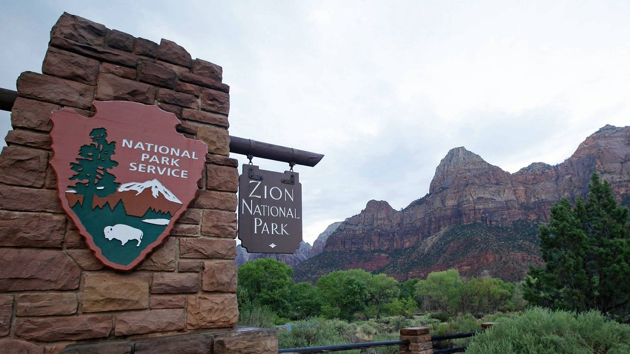 FILE - Zion National Park near Springdale, Utah, is pictured on Sept. 15, 2015. A woman died and a man was rescued and treated for hypothermia after they were caught in extreme cold weather while hiking in Utah's Zion National Park, officials said. (AP Photo/Rick Bowmer, File)