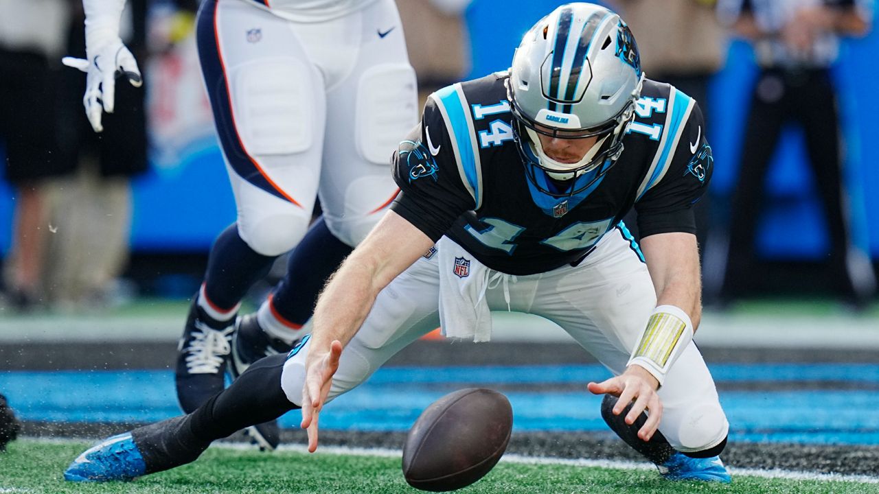 Carolina Panthers quarterback Sam Darnold (14) celebrates after scoring during the second half of an NFL football game between the Carolina Panthers and the Denver Broncos on Sunday, Nov. 27, 2022, in Charlotte, N.C. (AP Photo/Jacob Kupferman)