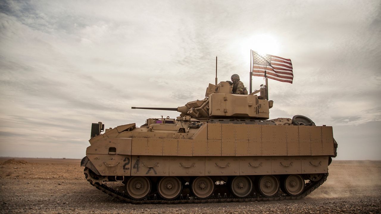 American soldiers drive a Bradley fighting vehicle during a joint exercise with Syrian Democratic Forces at the countryside of Deir Ezzor in northeastern Syria, Dec. 8, 2021. President Joe Biden said on Jan. 4, 2023, that's he's weighing sending Bradley Fighting Vehicles to help Ukraine in its effort to combat Russia's ongoing invasion.