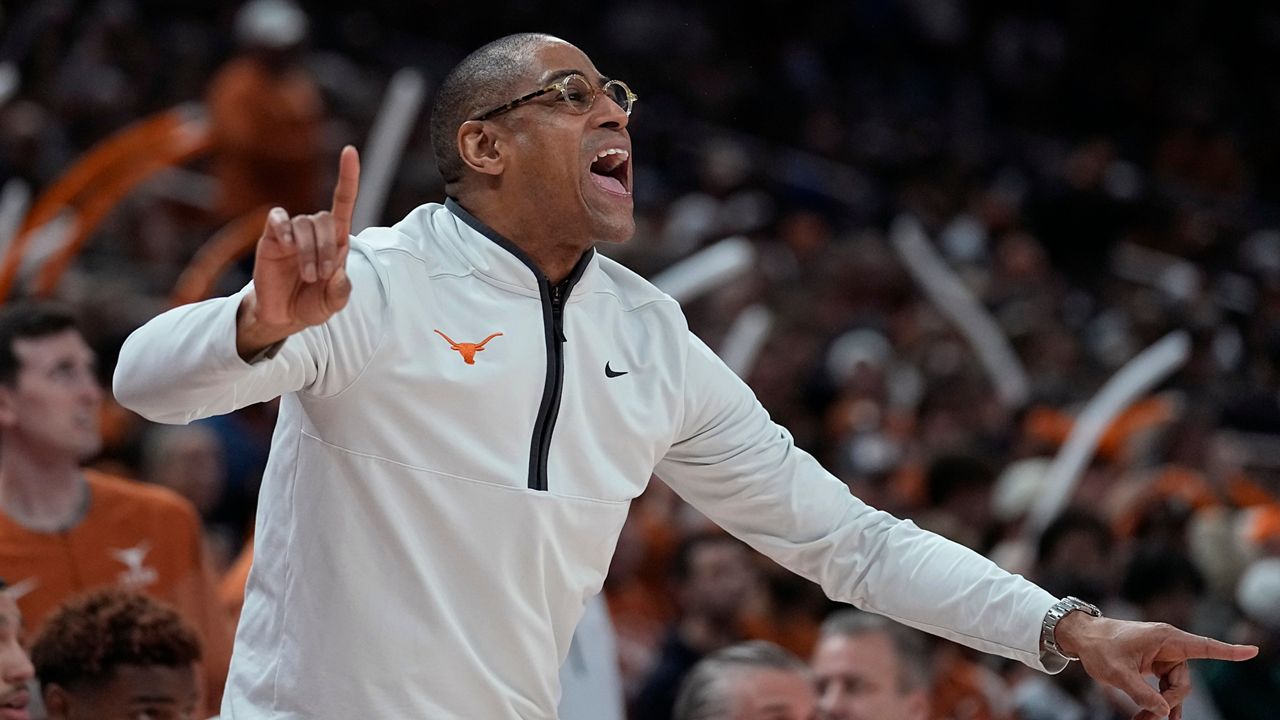 Texas interim coach Rodney Terry signals to players during the first half of the team's NCAA college basketball game against Oklahoma State in Austin, Texas, Tuesday, Jan. 24, 2023. (AP Photo/Eric Gay)