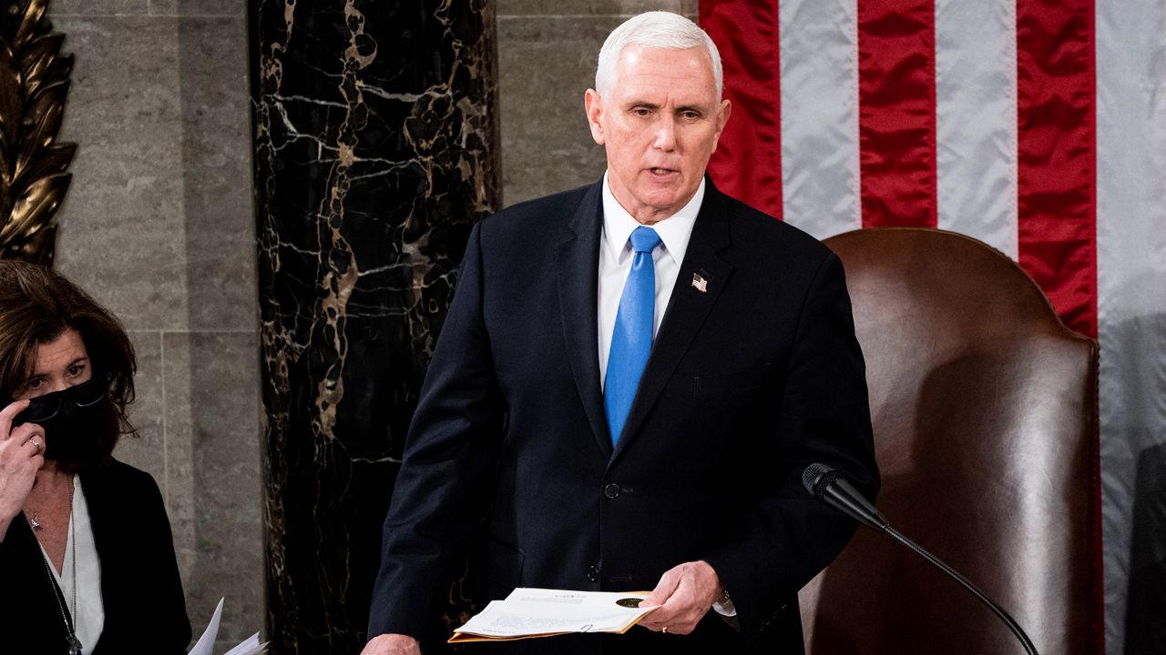 Vice President Mike Pence officiates as a joint session of the House and Senate convenes to confirm the Electoral College votes cast in November's election, at the Capitol in Washington, Wednesday, Jan. 6, 2021. Former Vice President Mike Pence has been subpoenaed by the special counsel overseeing investigations into efforts by former President Donald Trump and his allies to overturn the results of the 2020 election, Thursday, Feb. 9, 2023. (Erin Schaff/The New York Times via AP, Pool, File)