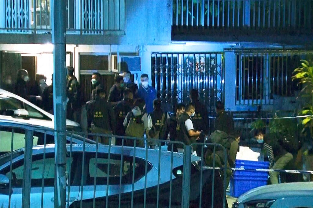 In this image taken from video footage provided by TVB Hong Kong, police officers search a village home where they found body parts related to a missing model in a murder case, in Hong Kong on Sunday, Feb. 26, 2023. Police in Hong Kong have filed murder charges against the former in-laws of a model, days after her body parts were found in a refrigerator. A police statement says Hong Kong model Abby Choi’s father-in-law and his eldest son are being charged with murder, while her mother-in-law faces one count of perverting the course of justice. (TVB Hong Kong via AP)