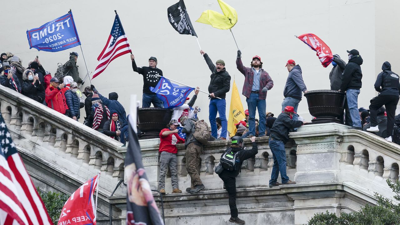 Rioters wave flags on the West Front of the U.S. Capitol in Washington on Jan. 6, 2021. AP Photo/Jose Luis Magana)