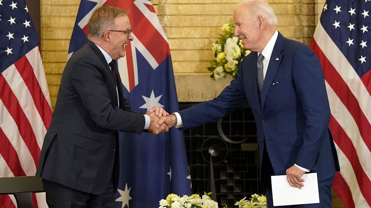President Joe Biden, right, shakes hands with Australian Prime Minister Anthony Albanese during the Quad leaders summit meeting at Kantei Palace, May 24, 2022, in Tokyo. (AP Photo/Evan Vucci)