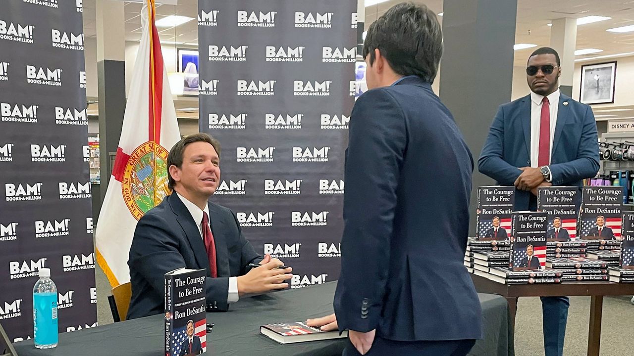 Florida Gov. Ron DeSantis greets supporters at a book signing event, Thursday, March 23, 2023 in Tallahassee, Fla. (AP Photo/Steve Peoples)