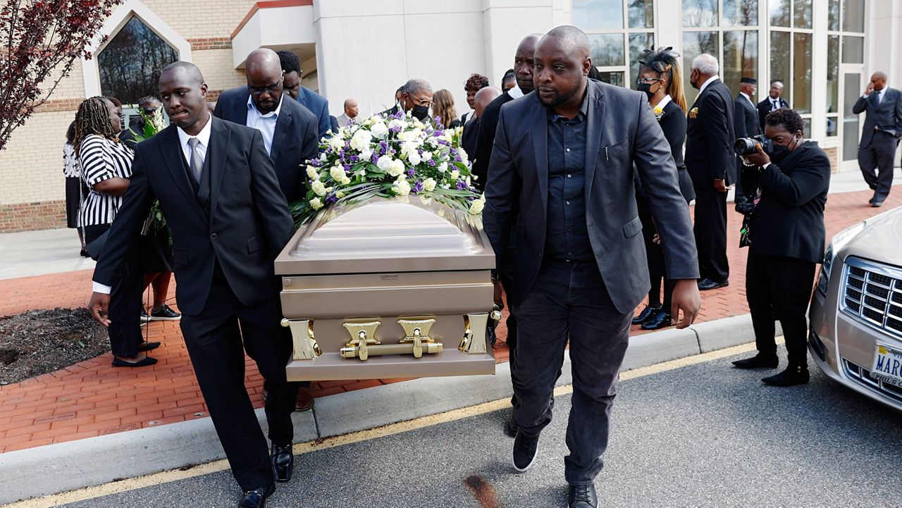 The casket of Irvo Otieno is carried out of First Baptist Church of South Richmond after the celebration of life for Irvo Otieno in North Chesterfield, Va., on Wednesday, March 29, 2023. Irvo Otieno, a 28-year-old Black man, died after he was pinned to the floor by seven sheriff's deputies and several others while he was being admitted to a mental hospital. (Eva Russo/Richmond Times-Dispatch via AP)