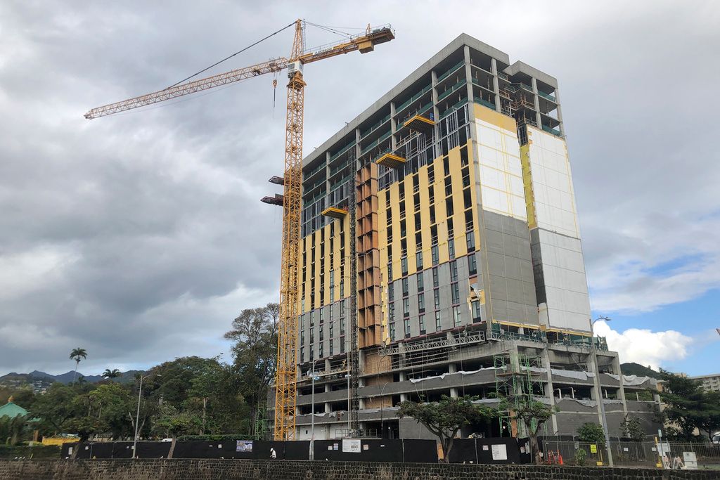 A new housing tower is seen under construction in Honolulu on March 27, 2023. Hawaii's housing shortage has set off a population decline and grown so acute it has sparked widespread concern many of Hawaii's children won't be able to afford living in their homeland as adults. (AP Photo/Audrey McAvoy)