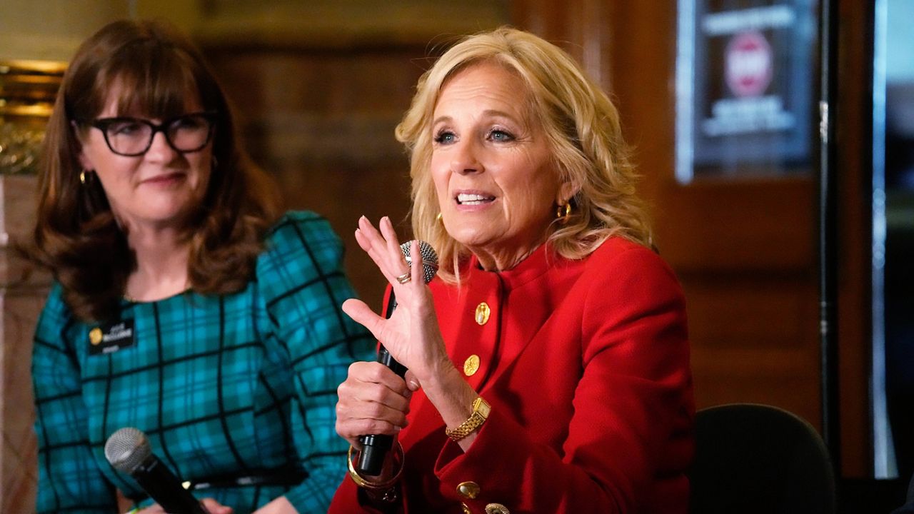 First lady Jill Biden, front, makes a point as Colorado Speaker of the House Julie McCluskie looks on during a stop to attend a roundtable discussion on the federal workforce training program to help community college students earn certificates for entry-level jobs Monday, April 3, 2023, inside the State Capitol in Denver. Both Republican and Democratic state lawmakers were on hand for the first lady's visit, the first of four stops across the country to promote the Biden Administration's effort to invest in America. (AP Photo/David Zalubowski)