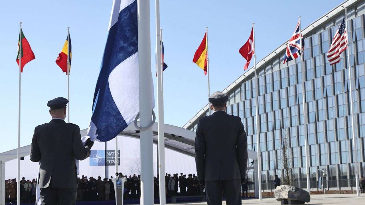 Military personnel prepare to raise the flag of Finland during a flag raising ceremony on the sidelines of a NATO foreign ministers meeting at NATO headquarters in Brussels, Tuesday, April 4, 2023. (AP Photo/Geert Vanden Wijngaert)