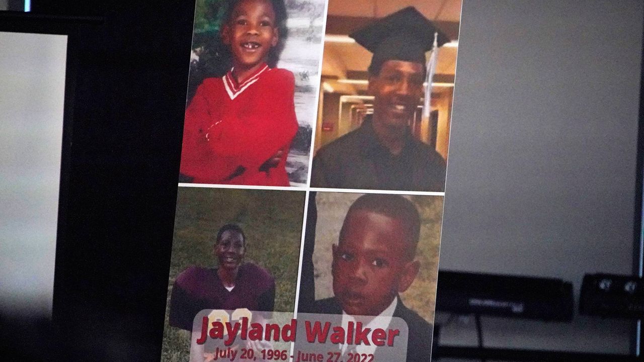  This is a poster on the stage during a news conference following the funeral service for Jayland Walker at the Akron Civic Center in Akron, Ohio, July 13, 2022. A grand jury in Ohio will hear evidence this week to decide whether police officers should face criminal charges in the shooting of Jayland Walker, a 25-year-old Black man whose death sparked protests in Akron last summer. (AP Photo/Gene J. Puskar)