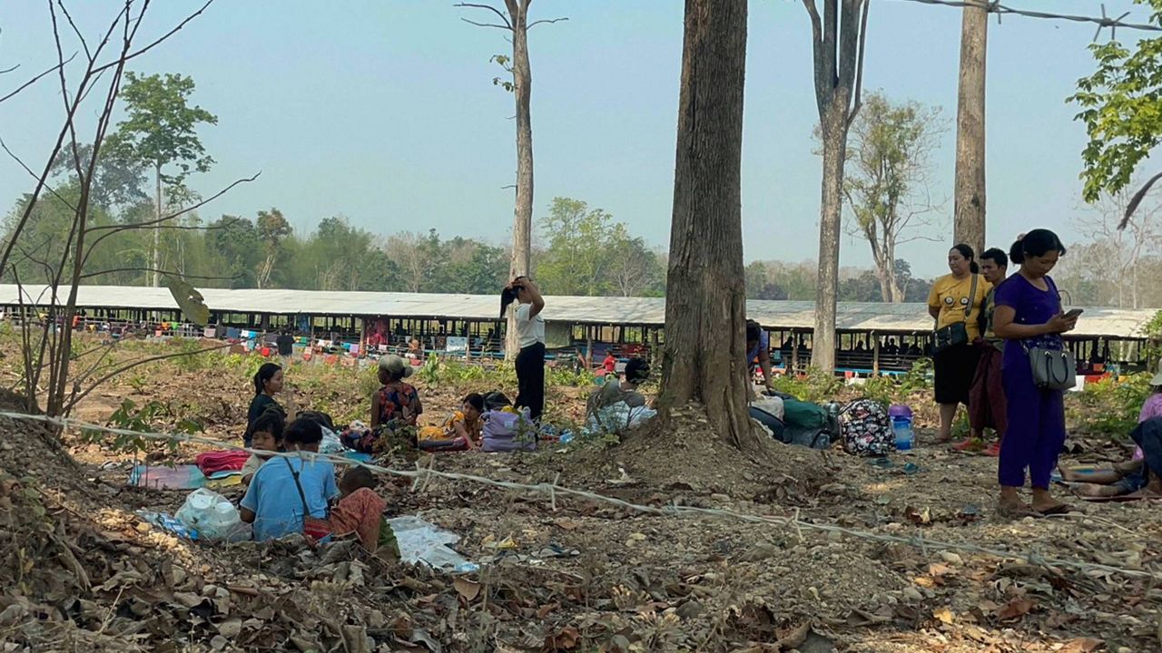 Residents from eastern Myanmar are seen after fleeing into Thailand's Tak Province from Myanmar's Myawaddy district, Thursday, April 6, 2023. More than 5,000 people have fled from eastern Myanmar into Thailand in recent days as combat between Myanmar’s army and its allies against armed resistance groups has intensified in the border area, Thai media and officials said Thursday. (AP Photo/Chiravuth Rungjamratratsami)