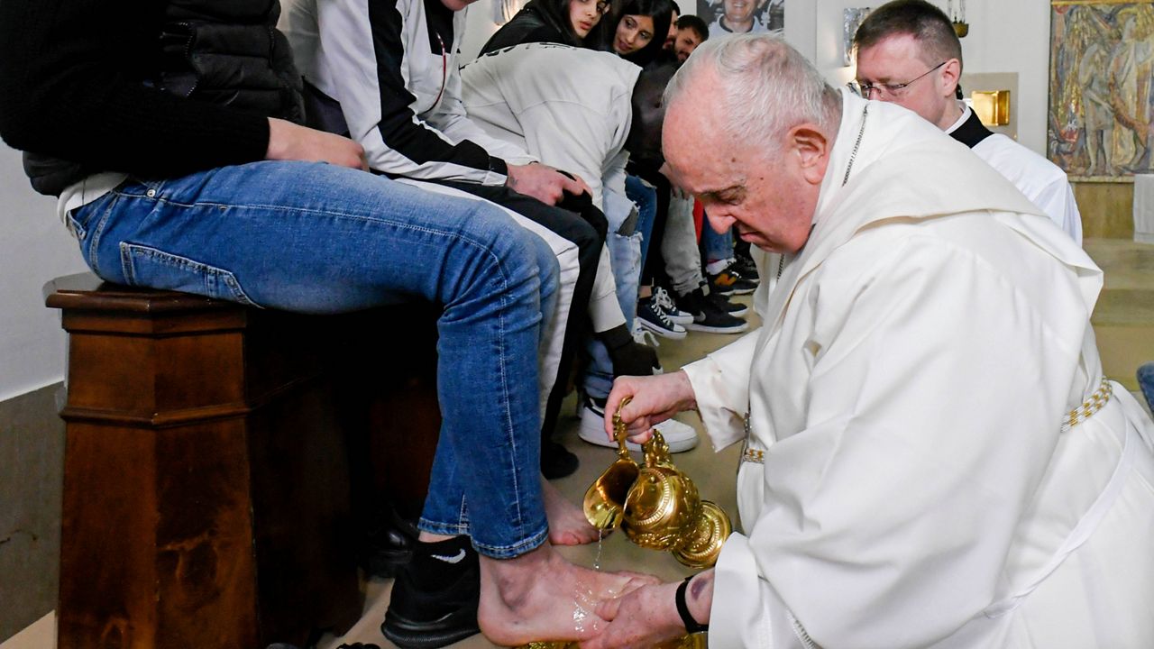 In this picture made available by Vatican Media Pope Francis washes the feet of the inmates of Rome's penitentiary of Casal del Marmo, Thursday, April 6, 2023. In a Holy Thursday ritual symbolizing humility, Pope Francis washed and wiped dry the bare feet of a dozen residents of a Rome juvenile prison, assuring them of their dignity and telling them "any of us" can fall into sin. (Vatican Media handout via AP)
