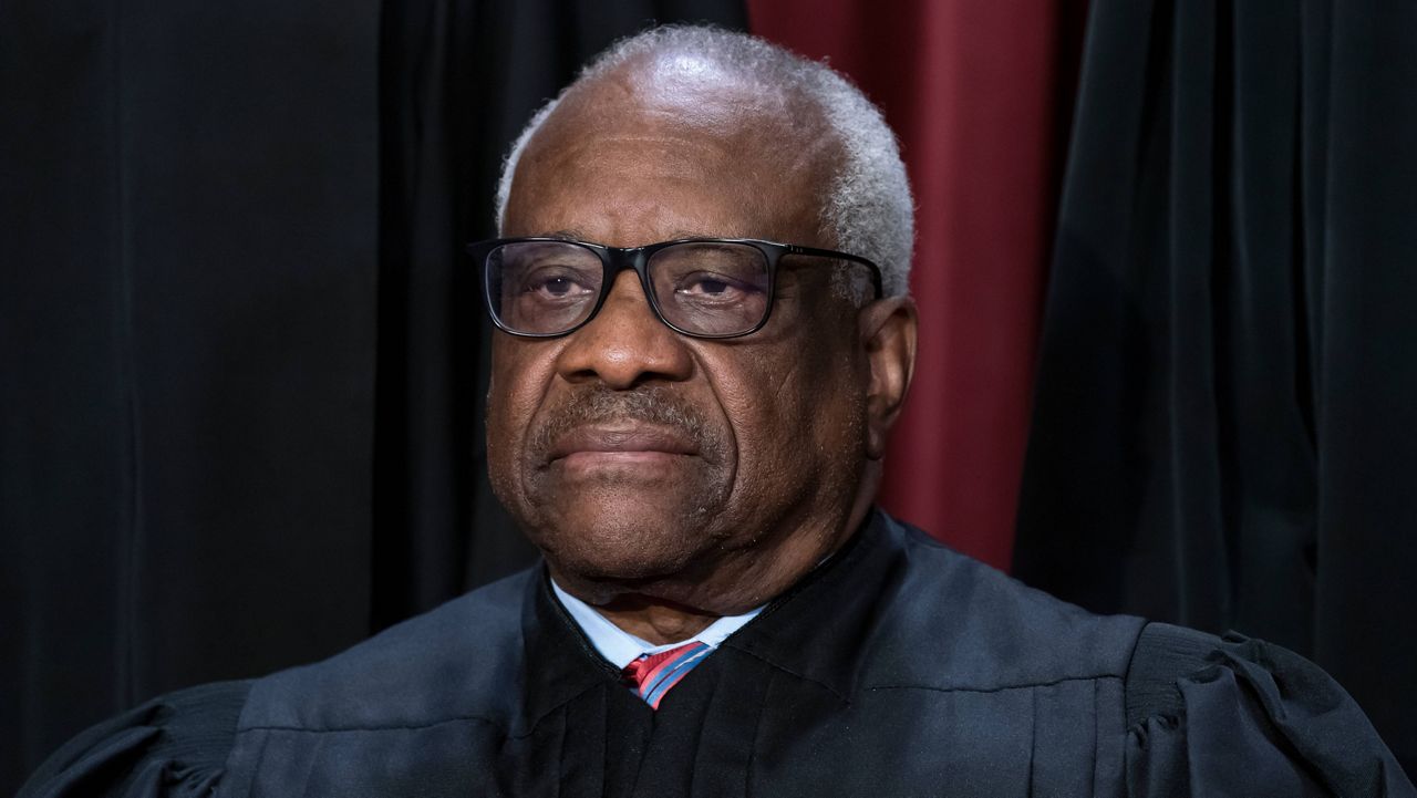 Associate Justice Clarence Thomas joins other members of the Supreme Court as they pose for a new group portrait, at the Supreme Court building in Washington, Oct. 7, 2022. (AP Photo/J. Scott Applewhite)