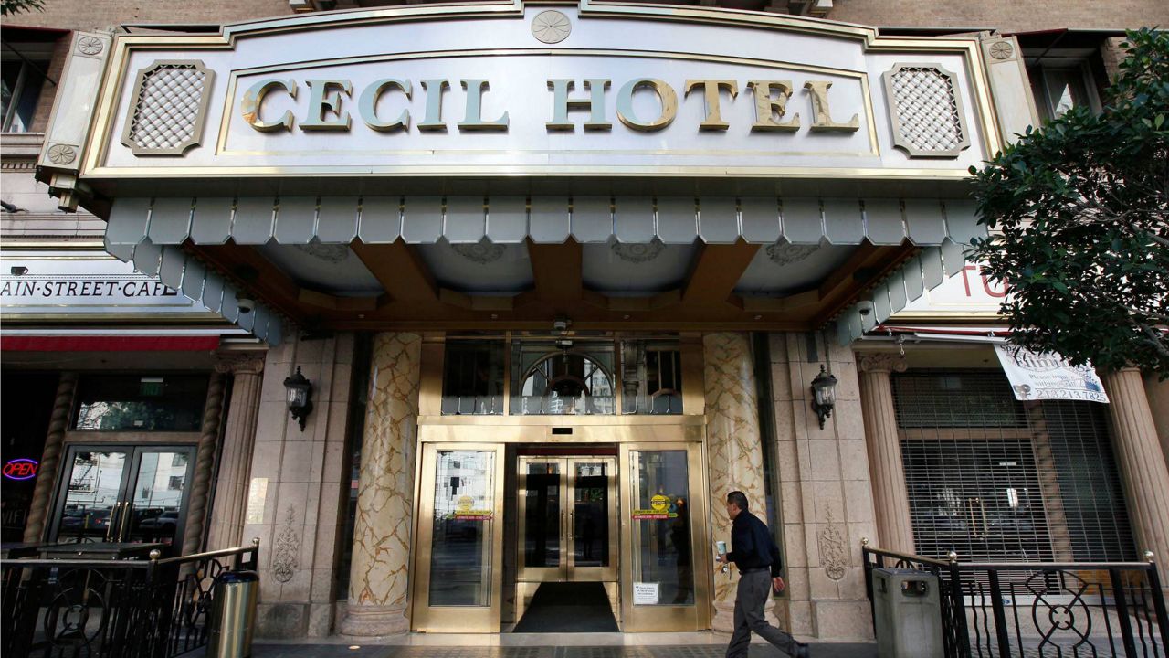A visitor arrives at the hotel Cecil on Feb. 20, 2013. (AP Photo/Nick Ut)