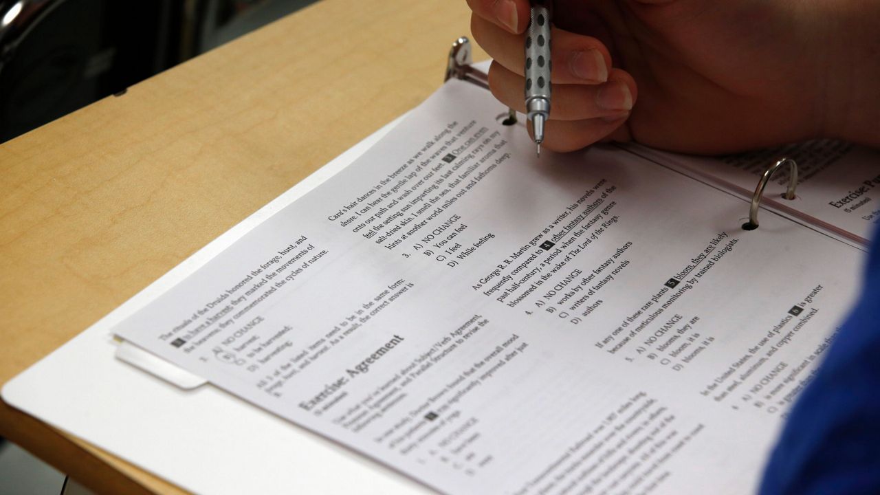 In this photo taken Jan. 17, 2016, a student looks at questions during a college test preparation class at Holton Arms School. (AP Photo/Alex Brandon)