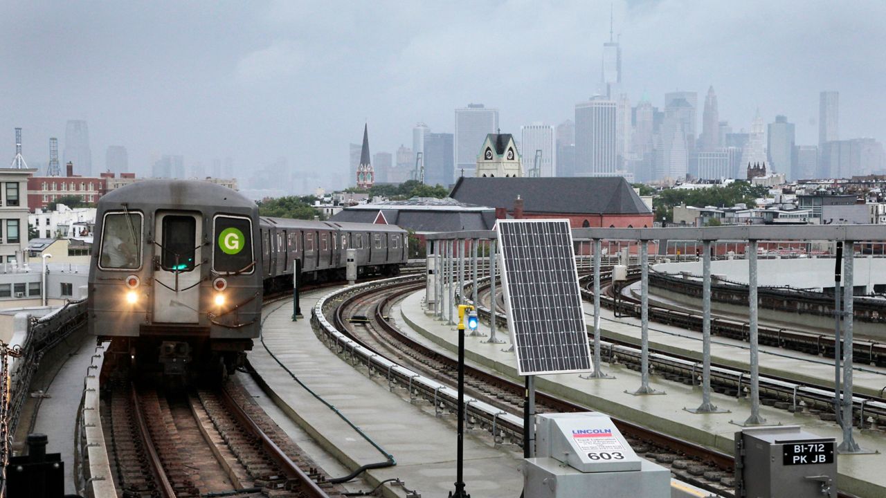 The G subway train enters the elevated Smith-Ninth Streets station in Brooklyn on July 29, 2013. (AP Photo/Mark Lennihan)