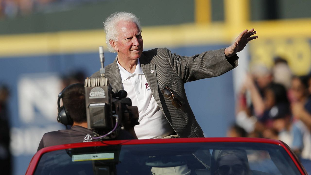 Atlanta Braves board caster and former L.A. Dodgers pitcher and baseball Hall of Fame member Don Sutton rides in a car around the field before a baseball game against the Dodgers Monday, July 20, 2015, in Atlanta. (AP/John Bazemore)