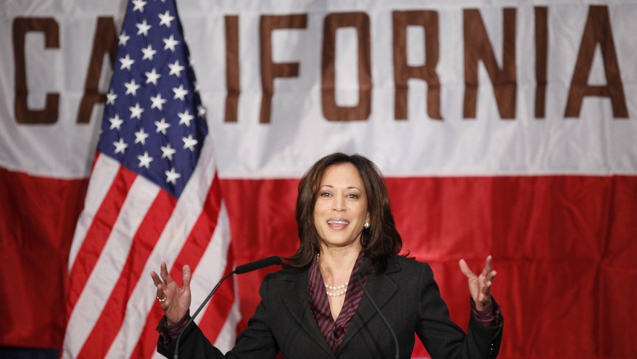 In this Nov. 30, 2010 file photo, then Calif. Attorney General Kamala Harris gives her first news conference in Los Angeles. (AP Photo/Damian Dovarganes, File)