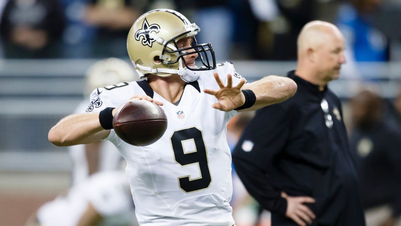 New Orleans Saints quarterback Drew Brees (9) warms up before an NFL football game against the Detroit Lions at Ford Field in Detroit, Sunday, Oct. 19, 2014. (AP Photo/Rick Osentoski)