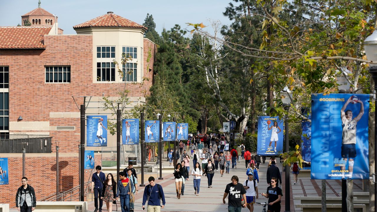 In this Feb. 26, 2015 file photo, students walk on the UCLA campus in Los Angeles. (AP Photo/Damian Dovarganes, File)