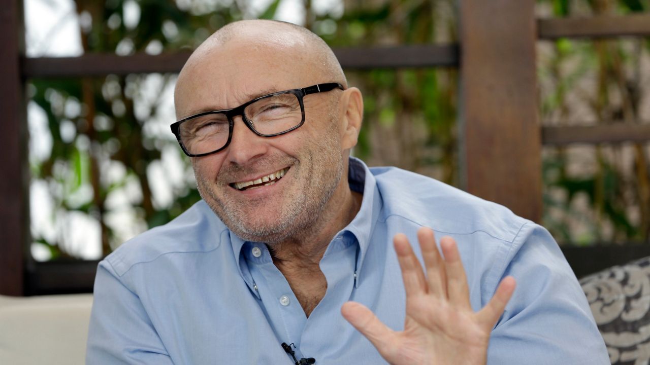 FILE - In this Dec. 4, 2013 file photo, British musician Phil Collins, smiles during an interview. (AP Photo/Alan Diaz, File)