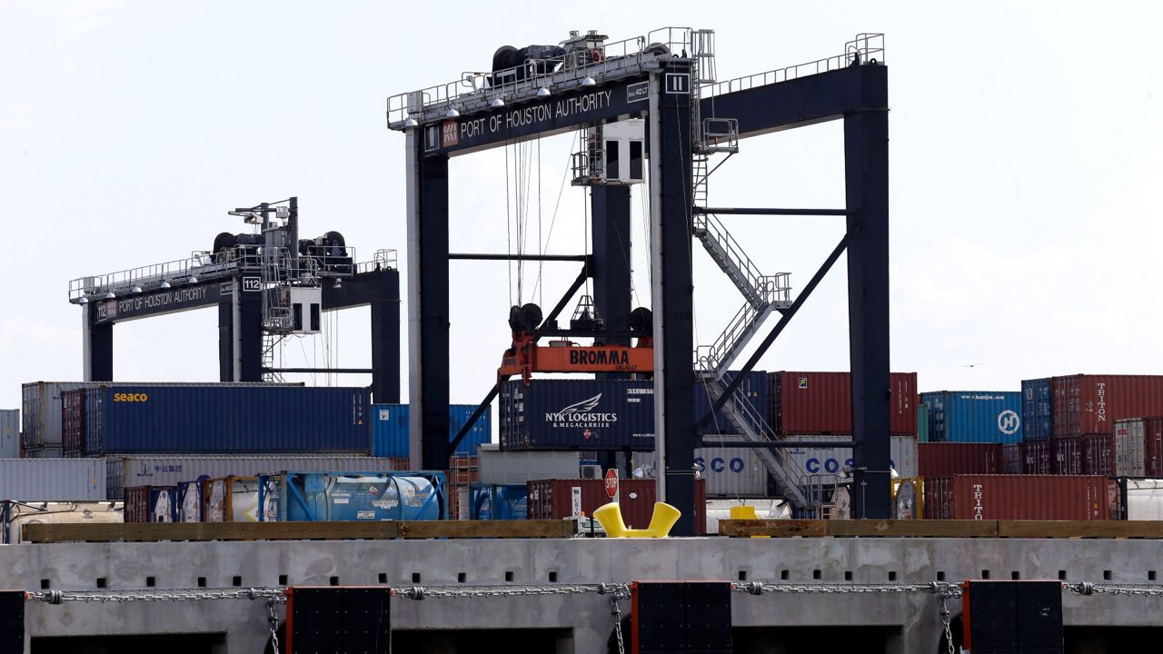 Containers are moved at the Port of Houston Authority Barbours Cut Container Terminal along the Houston Ship Channel Monday, Aug. 25, 2014, in La Porte, Texas. (AP Photo/David J. Phillip)