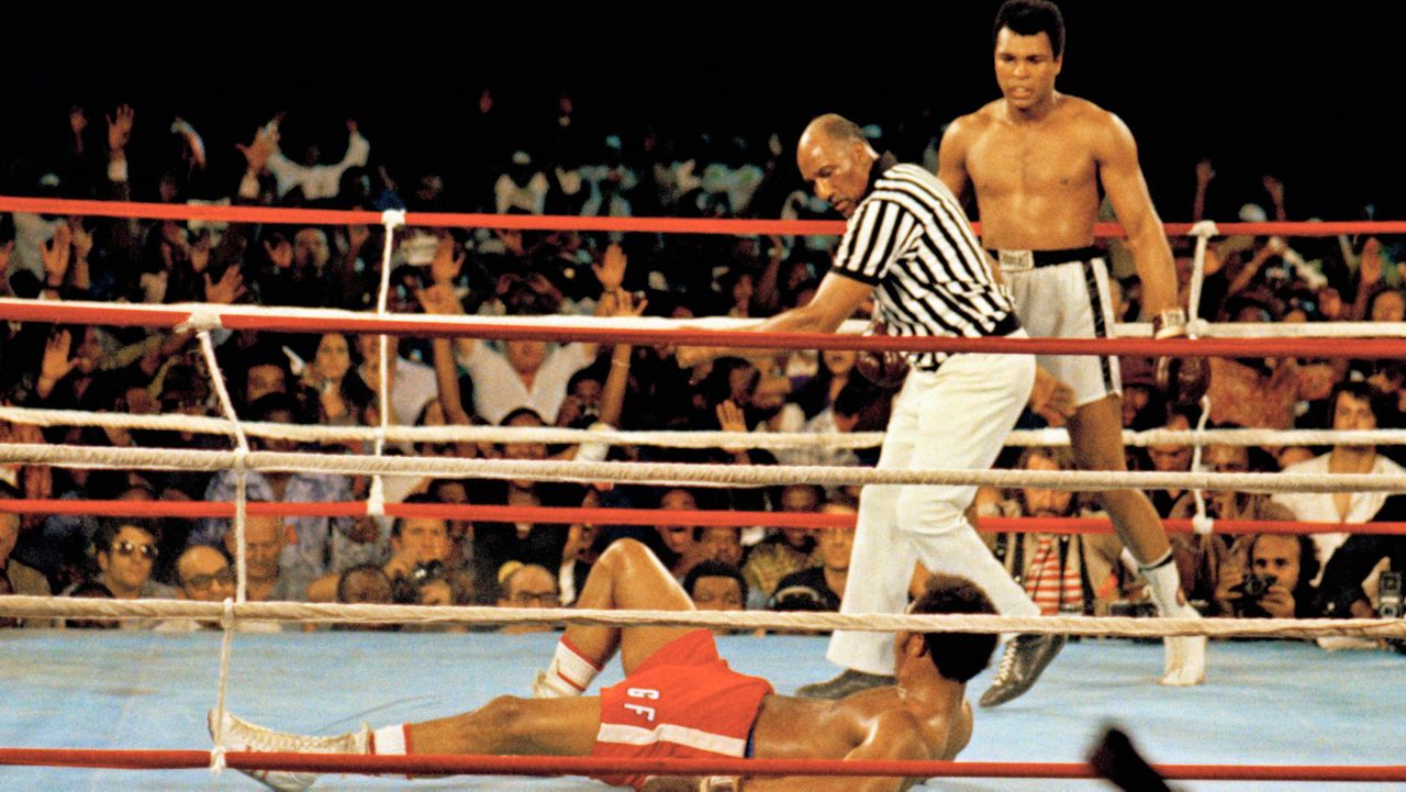  This is a Oct. 30, 1974 file photo of Muhammad Ali, right, as he stands back as referee Zack Clayton calls the count over opponent George Foreman, red shorts, in Kinshasa, Zaire. (AP Photo)