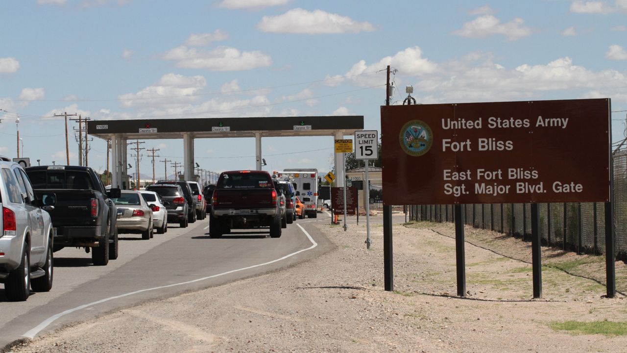 Cars wait to enter Fort Bliss in El Paso, Texas, Tuesday Sept. 9, 2014. (AP Photo/Juan Carlos Llorca)