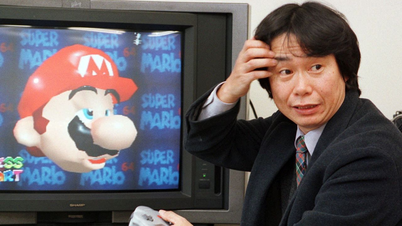 FILE - In this Feb. 6, 1997 file photo, Shigeru Miyamoto, creator of Super Mario video game series, demonstrates Super Mario 64 in his office at the Nintendo Co. headquarters in Kyoto, Japan. (AP Photo/Atsushi Tsukada)