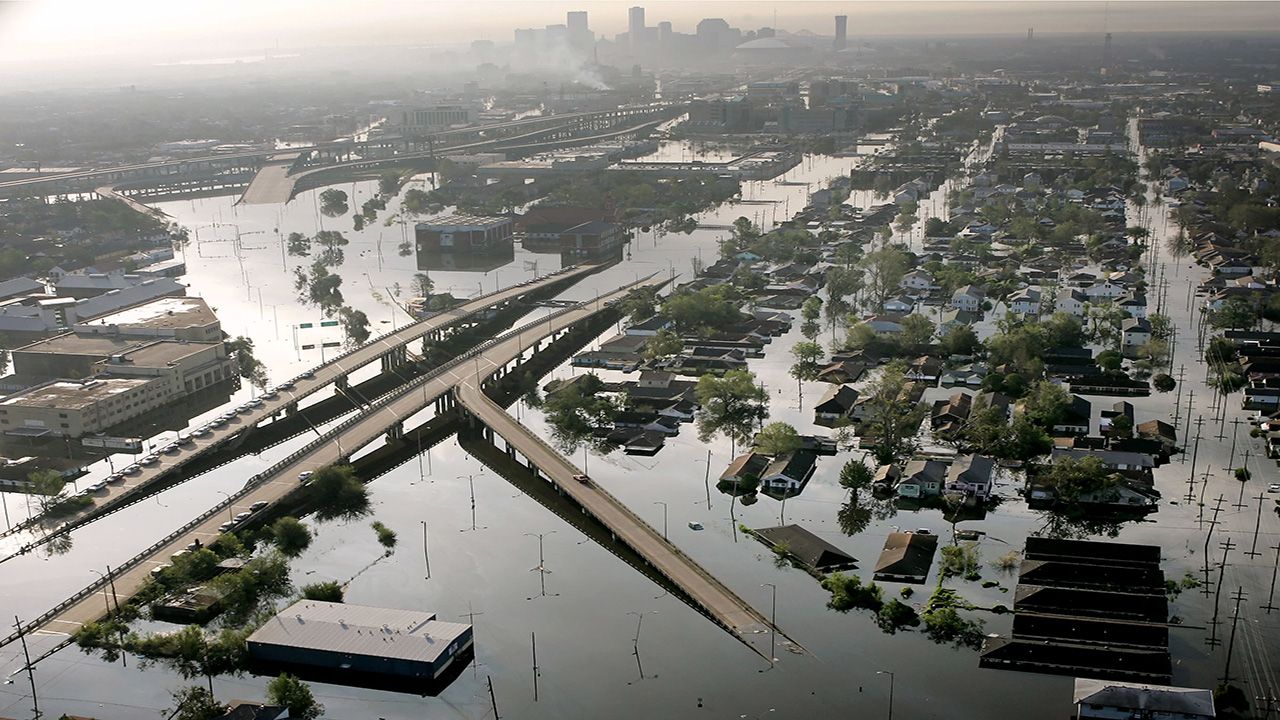 In a Aug. 30, 2005 file photo, floodwaters from Hurricane Katrina fill the streets near downtown New Orleans. (AP Photo/David J. Phillip, File)