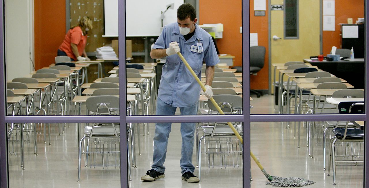 A classroom is cleaned in this file image. (Associated Press)