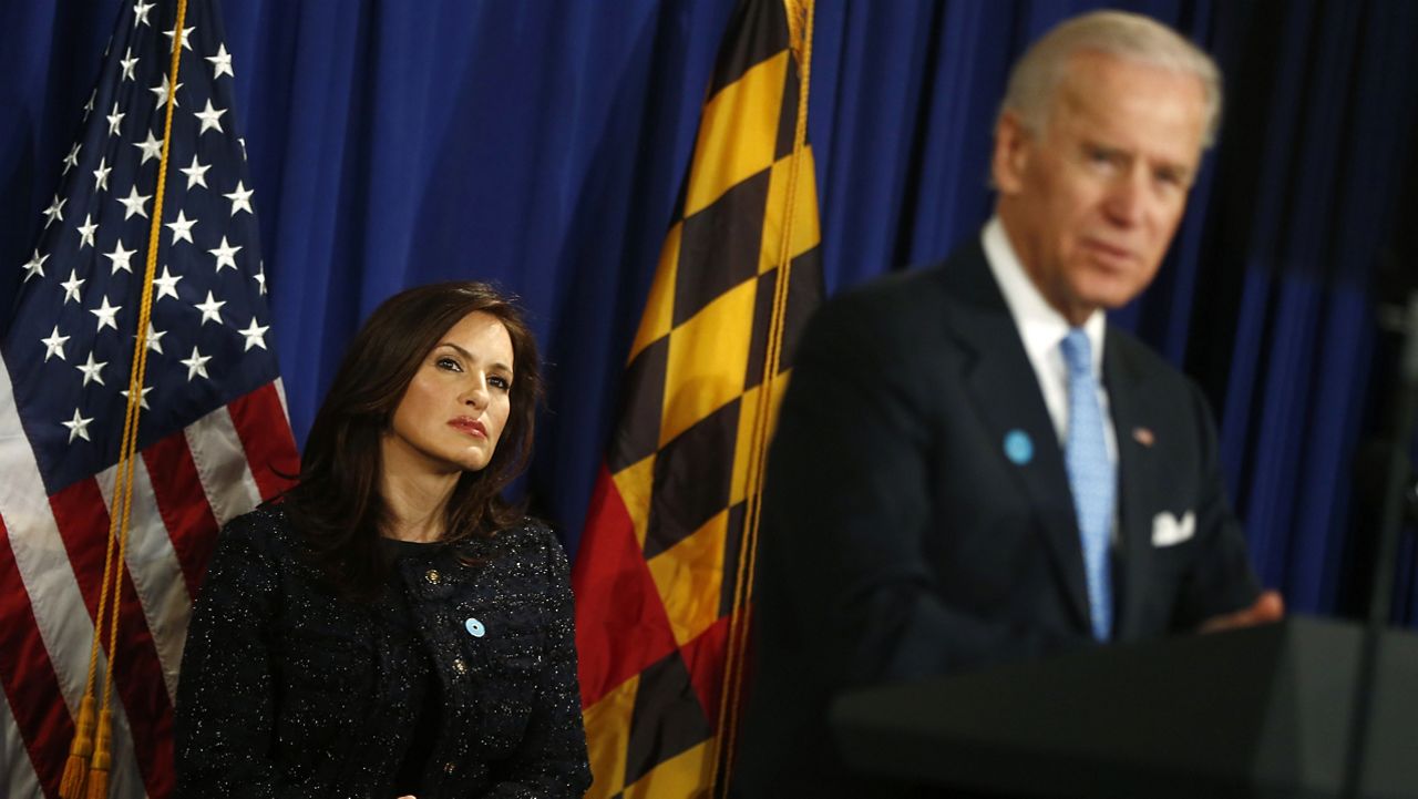 FILE - Actress Mariska Hargitay listens as then-Vice President Joe Biden speaks about reducing domestic violence, Wednesday, March 13, 2013, at the Montgomery County, Md. Executive Office Building in Rockville, Md. (AP Photo/Charles Dharapak)