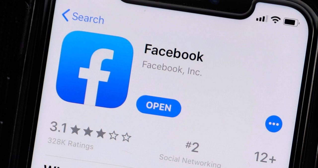 The Facebook app is available for download in this file image. (Associated Press)