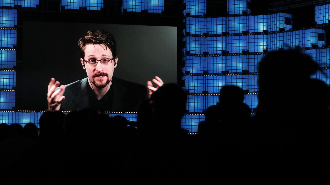 FILE - Former U.S. National Security Agency contractor Edward Snowden addresses attendees through video link at the Web Summit technology conference in Lisbon, Monday, Nov. 4, 2019. (AP Photo/Armando Franca)