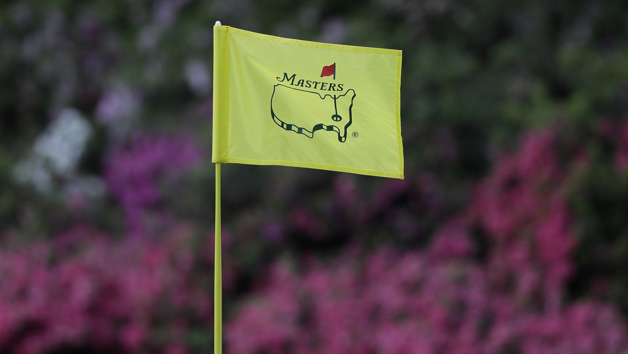 FILE - In this April 11, 2019, file photo, the flag on the 13th hole blows in the wind during the first round for the Masters golf tournament in Augusta, Ga. (AP Photo/David J. Phillip, Fil)