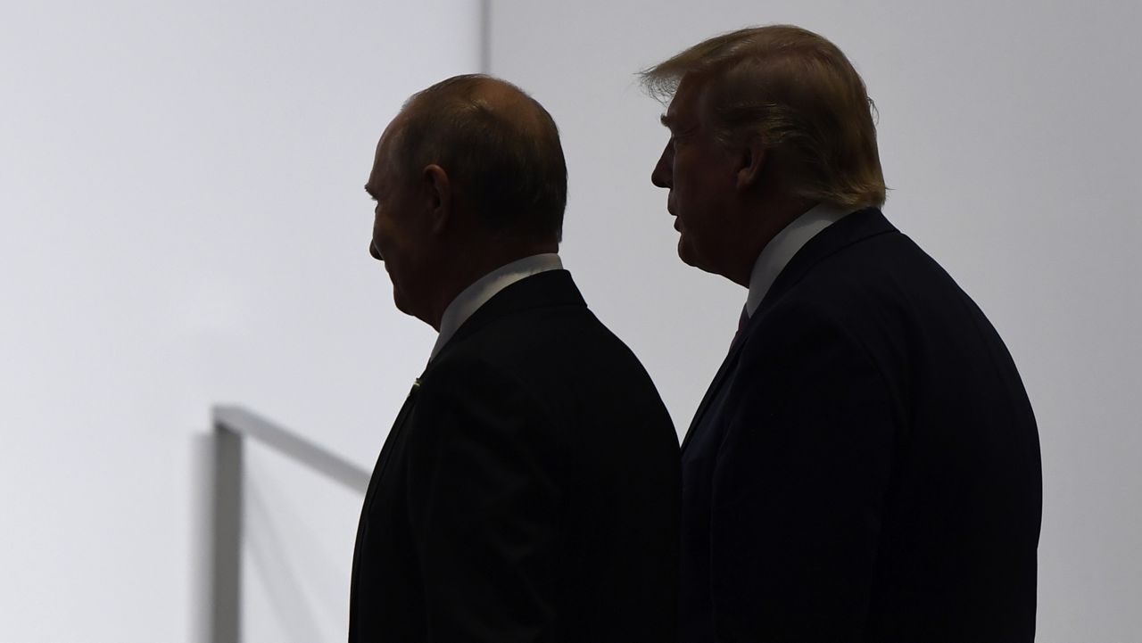 FILE - In this June 28, 2019, file photo, President Donald Trump and Russian President Vladimir Putin walk to participate in a group photo at the G20 summit in Osaka, Japan. (AP Photo/Susan Walsh, File)