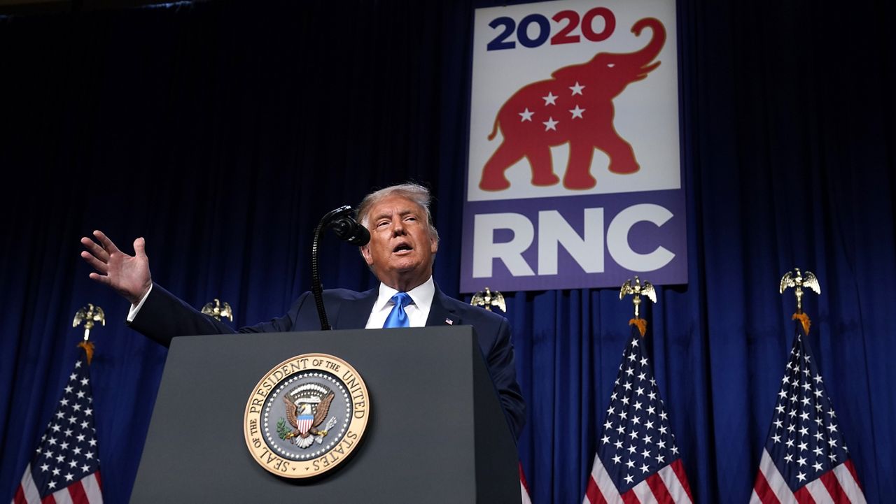 President Donald Trump speaks on stage during the first day of the Republican National Committee convention, Monday, Aug. 24, 2020, in Charlotte. (AP Photo/Evan Vucci)