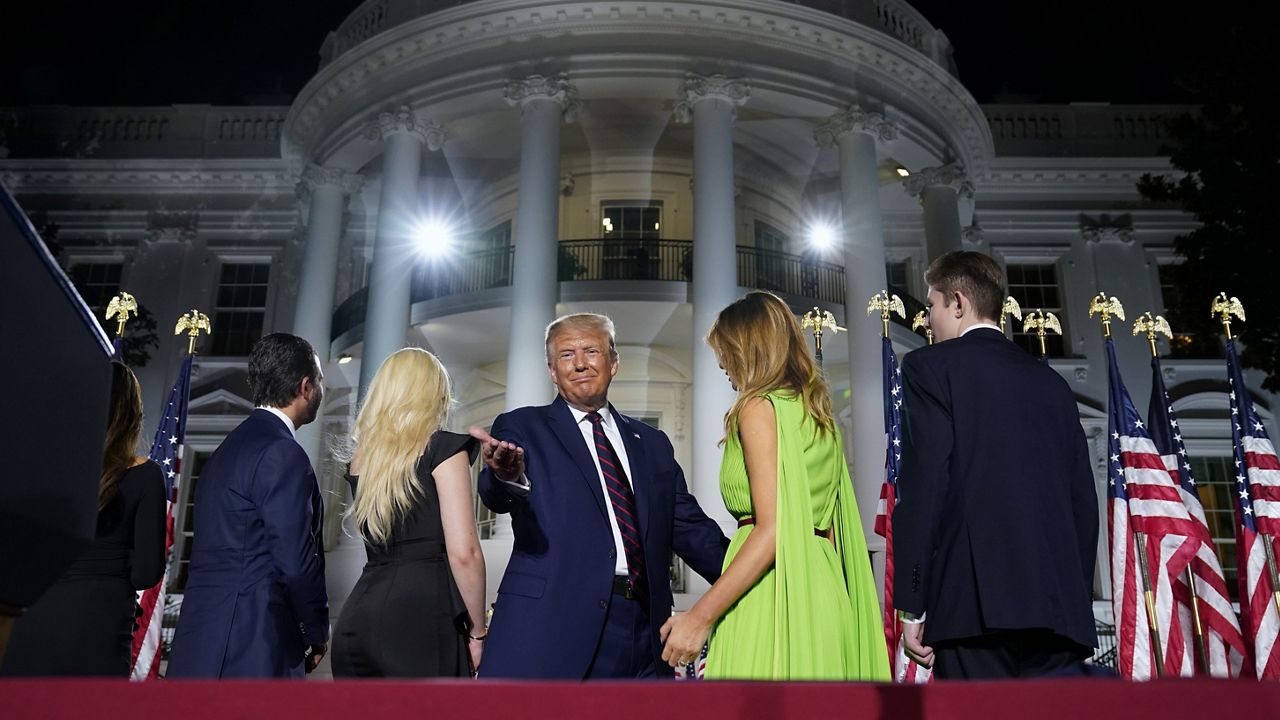 From left, Donald Trump Jr., Tiffany Trump, President Donald Trump, first lady Melania Trump and Barron Trump stand on stage on the South Lawn of the White House on the fourth day of the Republican National Convention, Thursday, Aug. 27, 2020, in Washington. (AP Photo/Evan Vucci)