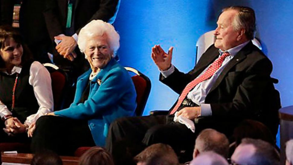 In this Thursday, Feb. 25, 2016 file photo, former President George H. W. Bush, right, and his wife, Barbara, are greeted before a Republican presidential primary debate at The University of Houston in Houston. On Wednesday, Jan. 18, 2017, the former president was admitted to an intensive care unit, and Barbara was hospitalized as a precaution, according to his spokesman. (AP Photo/David J. Phillip)