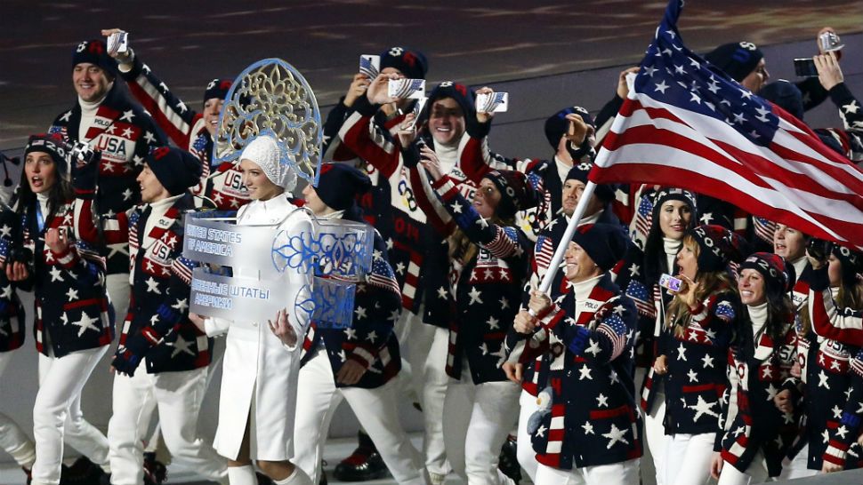 FILE - In this Friday, Feb. 7, 2014 file photo, members of the United States Olympic team _ many of them holding up mobile phones to record the moment _ enter Fisht Stadium in Sochi, Russia, for the opening ceremony of the 2014 Winter Olympics. Picking up new followers on Twitter, Facebook and other social media platforms is the smart play for Olympians at the Sochi Games. Athletes who share their experiences from their privileged backstage access at the games could come home from Russia with far stronger hands to woo and squeeze more money from sponsors. (AP Photo/Petr David Josek, File)