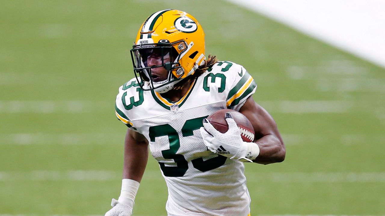 Green Bay Packers running back Aaron Jones (33) carries in the second half of an NFL football game 