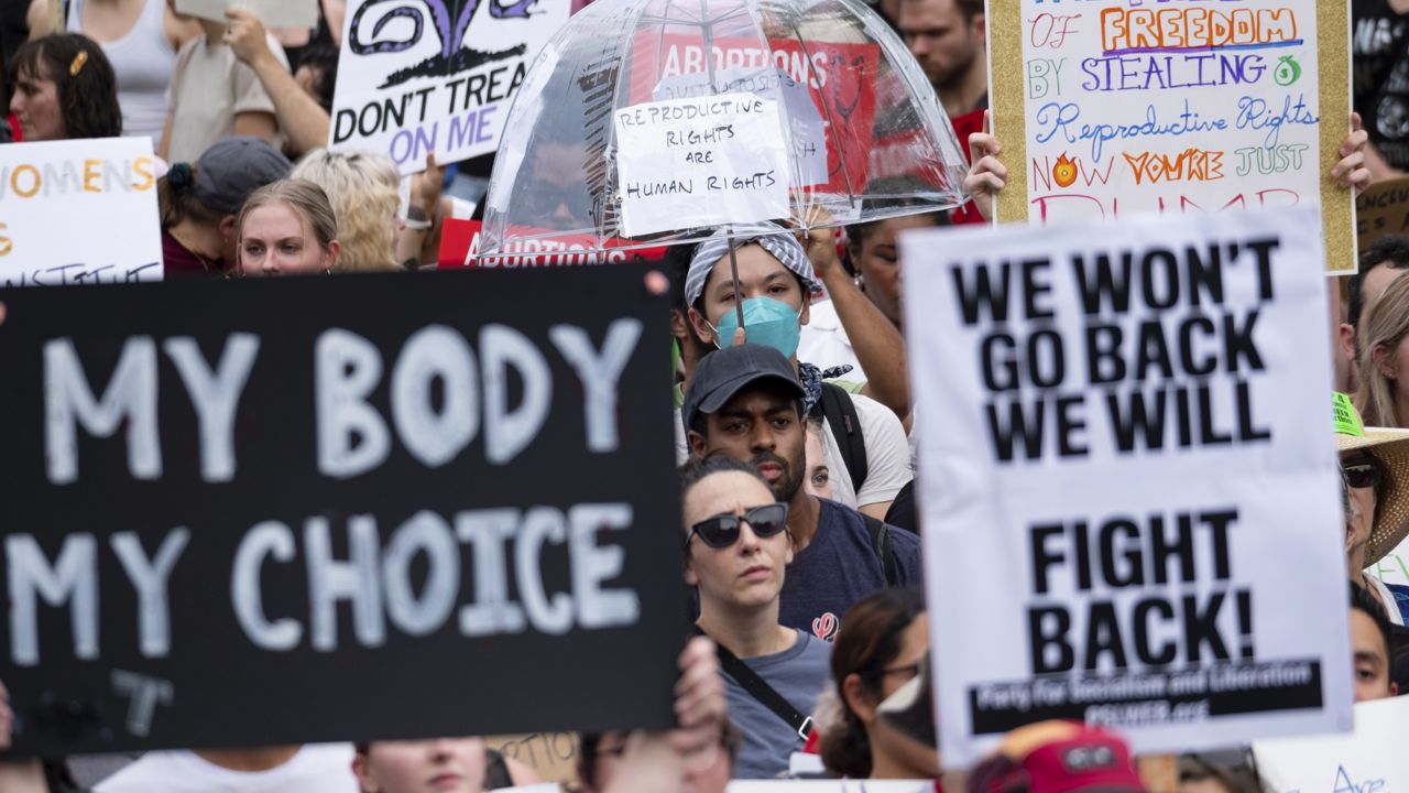 People gather in front of the Georgia State Capital in Atlanta on Friday, June 24, 2022, to protest to protest the Supreme Court's decision to overturn Roe v. Wade. (AP Photo/Ben Gray, File)