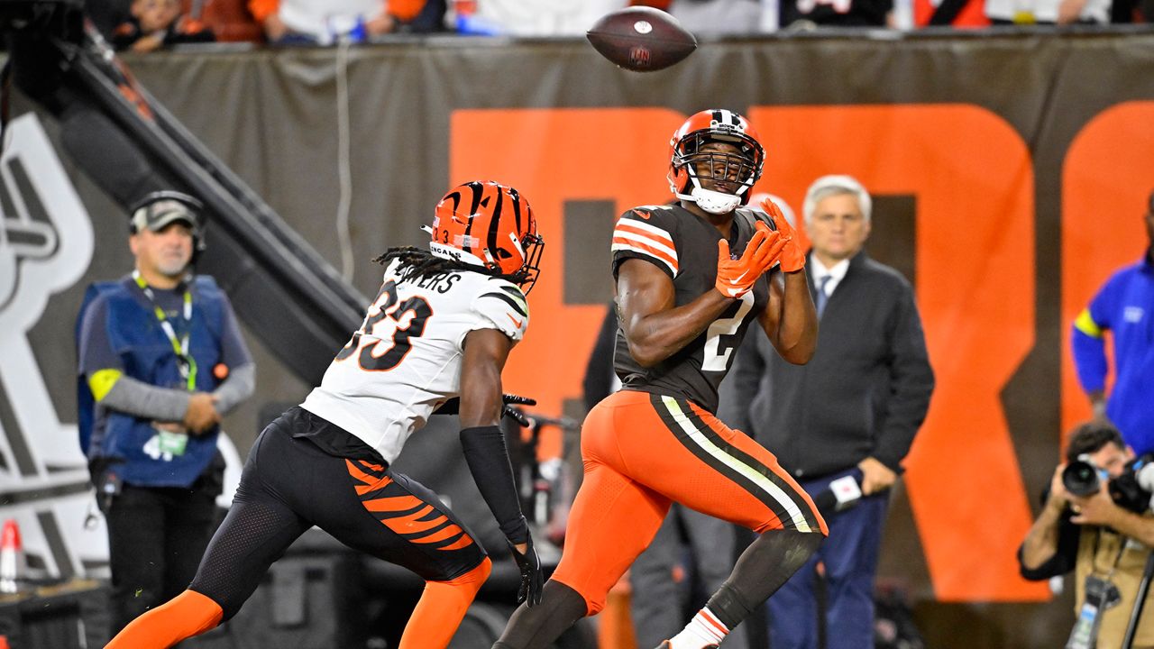 Cleveland Browns wide receiver Amari Cooper (2) catches a pass from quarterback Jacoby Brissett for a touchdown with Cincinnati Bengals cornerback Tre Flowers (33) defending during the second half of an NFL football game in Cleveland, Monday, Oct. 31, 2022. (AP Photo/David Richard)