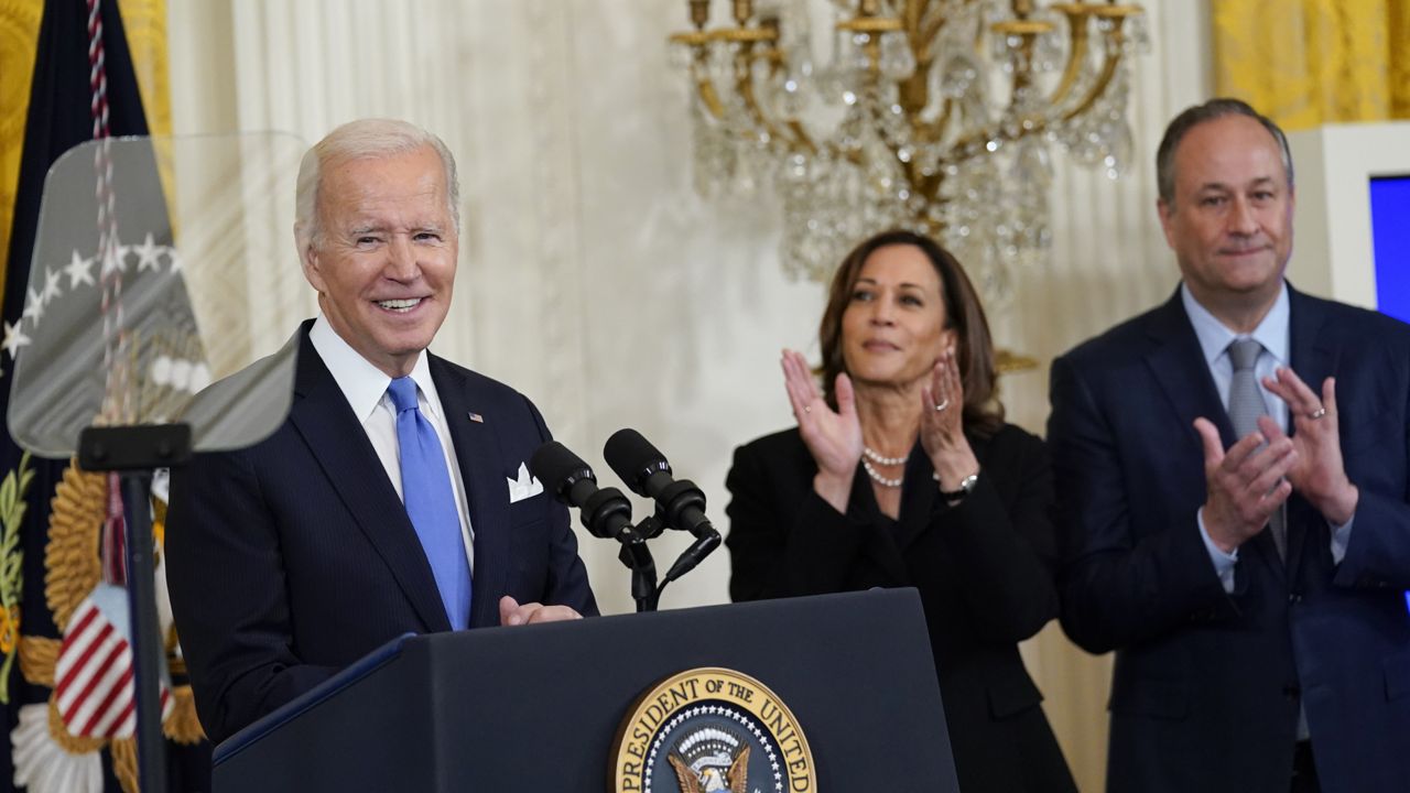 President Joe Biden speaks during a reception to celebrate the Jewish new year in the East Room of the White House in Washington, Friday, Sept. 30, 2022. Vice President Kamala Harris and her husband Doug Emhoff applaud at right. (AP Photo/Susan Walsh)
