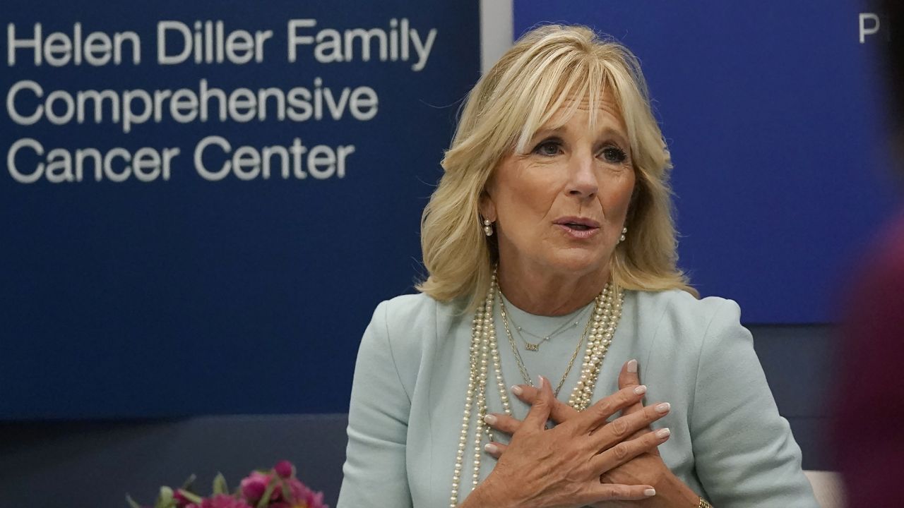 First lady Jill Biden gestures while meeting with medical professionals and students during a visit to the University of California San Francisco Helen Diller Family Comprehensive Cancer Center in San Francisco, Friday, Oct. 7, 2022. (AP Photo/Jeff Chiu, Pool)