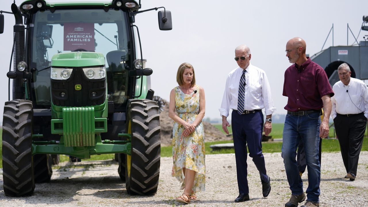 President Joe Biden walks with O'Connor Farms owners Jeff O'Connor and Gina O'Connor, left, at the farm Wednesday, May 11, 2022, in Kankakee, Ill. (AP Photo/Andrew Harnik)