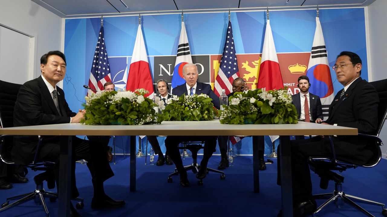 President Joe Biden, center, meets with South Korea's President Yoon Suk Yeol, left, and Japan's Prime Minister Fumio Kishida during the NATO summit in Madrid, on June 29, 2022. (AP Photo/Susan Walsh, File)