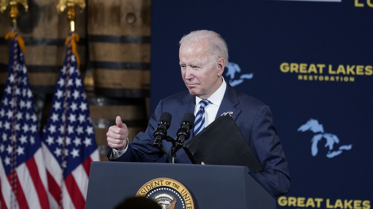 President Joe Biden gives a thumbs up after speaking about the long-delayed cleanup of Great Lakes harbors and tributaries polluted with industrial toxins at the Shipyards, Thursday, Feb. 17, 2022, in Lorain, Ohio. (AP Photo/Alex Brandon)
